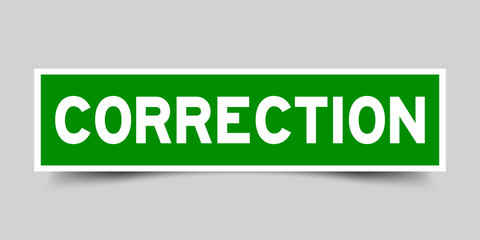Label sticker in green color square shape as word correction on white background