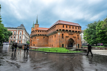Obraz premium Krakow Barbican and rainy cityscape.