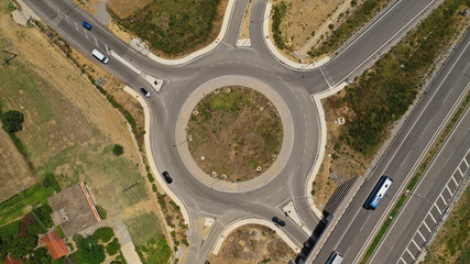 Aerial drone photo of modern motorway roundabouts of Ionia Odos near famous cable bridge of Rio - Antirio Harilaos Trikoupis, Antirio, Greece