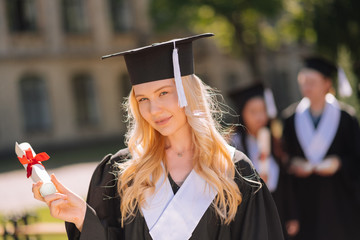 Beautiful girl being happy at her graduation ceremony.