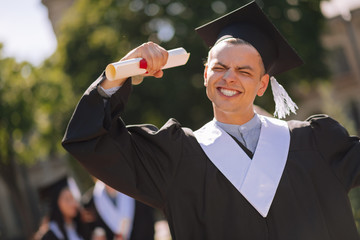 Excited graduate being happy to move on in his life.