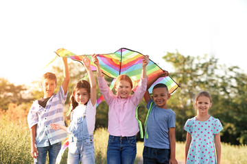 Little children flying kite outdoors