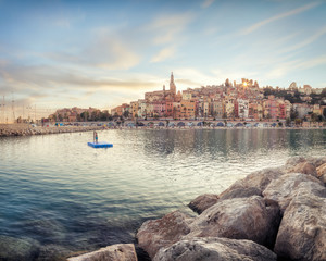 Fototapeta premium Public beach of Menton old town at sunset