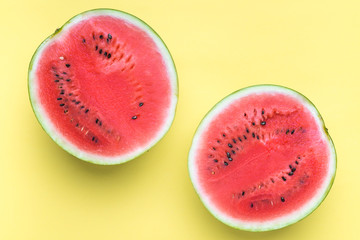 Colorful fruit background of watermelon slices on yellow background