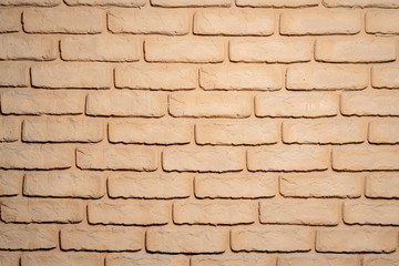 The background of the brick wall is brown.