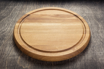 pizza cutting board at rustic wooden table