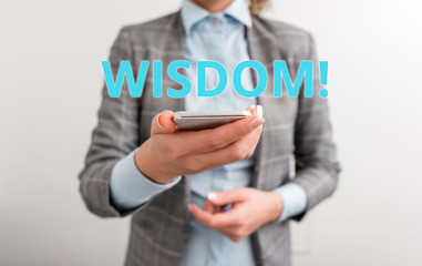 Word writing text Wisdom. Business photo showcasing quality having experience knowledge and good judgement something Business concept with mobile phone and business woman