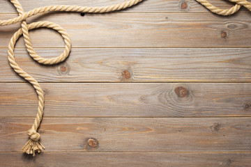 ship rope at wooden background texture