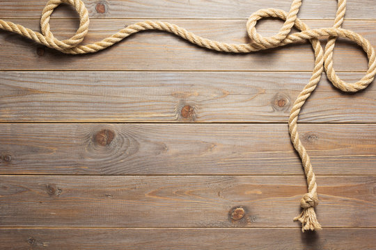 Ship Rope At Wooden Background Texture