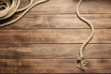 ship rope at wooden board background