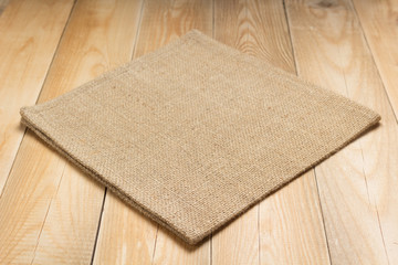 burlap hessian sacking cloth on wooden table - 282384792