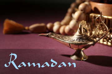 Aladdin lamp of wishes on color table