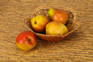 Pear heap in the wooden basket