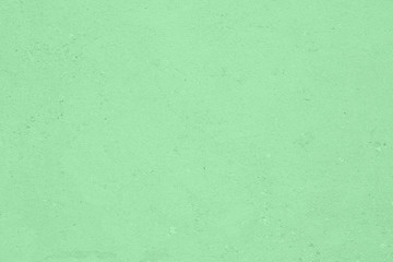 Trendy neo mint colored low contrast Concrete textured background with roughness and irregularities to your design or product. Year color trend concept.	