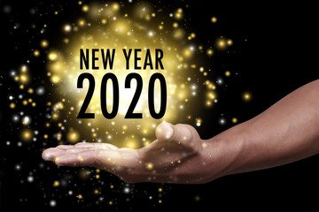 Year 2020 with hand.
