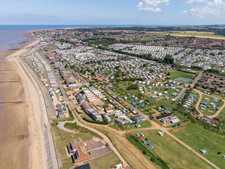 Fototapeta na wymiar Aerial photo of the British seaside town of Hunstanton in Norfolk showing the coastal area and beach and alsop the caravan holiday park.