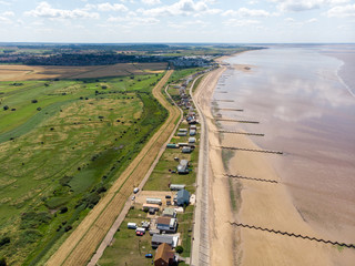Aerial photo of the British seaside town of Hunstanton in Norfolk showing the coastal area and beach and alsop the caravan holiday park.