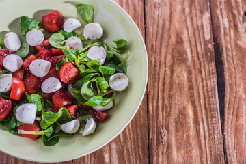 Fresh delicious tomatoes. With mozzarella cheese typical italian healthy cuisine culture.. Red tomatoes on a wood background.