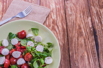Fresh delicious tomatoes. With mozzarella cheese typical italian healthy cuisine culture.. Red tomatoes on a wood background.