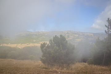Ai-petri mountain in the fog. High mountain. Crimea. Russian mountains. Low clouds. Beautiful mountain landscape. The famous AI Petri mountain, partially covered with clouds, fog