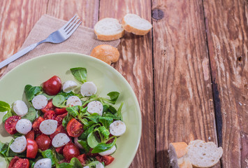 Fresh delicious tomatoes. With mozzarella cheese typical italian healthy cuisine culture.. Red tomatoes on a wood background.