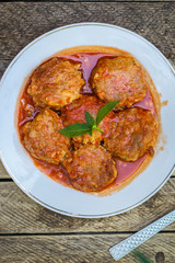 meatballs, tasty meat dish (ground meat, tomato sauce, vegetables) falafel. top food background. copy space