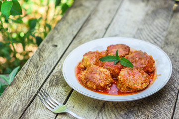 meatballs, tasty meat dish (ground meat, tomato sauce, vegetables) falafel. top food background. copy space