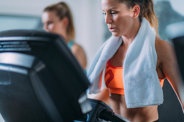 Fototapeta premium Women Exercising on Treadmill.