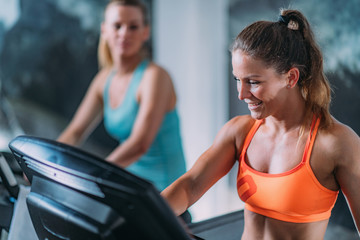 Women Exercising on Treadmill.