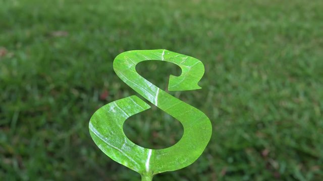 Green Eco-friendly and circular economy concept, leaf in form of arrow infinity recycling shape, flying floating in the air, with pollution city background and dark clouds, blue sky