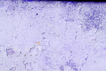 Old painted wall of purple color texture close up. Abstract background