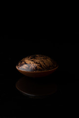 Amazing Chocolate bonbon on black background close-up