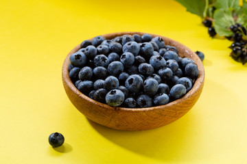 Fresh berry in wooden bowl