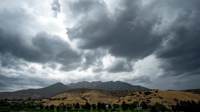 Time lapse of dramatic storm clouds rolling overhead towards Timpanogos Mountain in Utah.