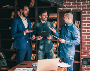 friendly business team discussing financial documents near the w