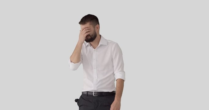 Penniless businessman crying and coming up with brilliant positive idea while pointing over copy space
