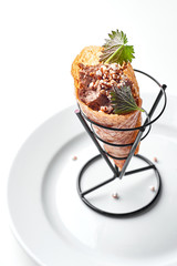 poultry pate served on a white plate in an ice cream cone