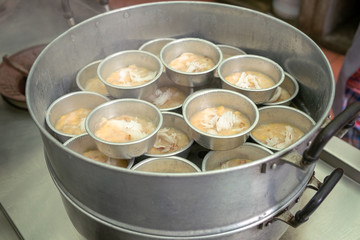 Banana Tart and Coconut Meat Topping in Steamed Pot, Traditional Thailand Cuisine Dessert