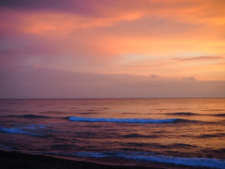Fototapeta premium picturesque Pink sunset on lake beach sea sand beautiful colors in the sky clouds