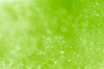 Abstract Green bokeh defocus glitter blur Background.