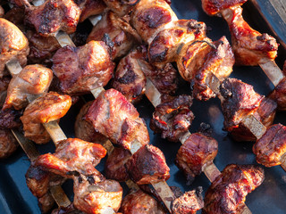 Roasted meat on skewers.
