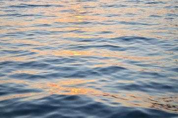 Sparkling water surface on sunset.  Nature background concept. - Image