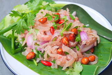 Thai traditional food fermented ground pork, fresh red and green chilli on fresh whole banana leaf