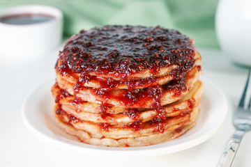Classic american pancakes with raspberries jam