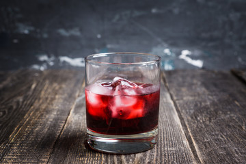 Old fashioned cherry cocktail with berries. Selective focus. Shallow depth of field. 