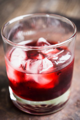 Old fashioned cherry cocktail with berries. Selective focus. Shallow depth of field. 