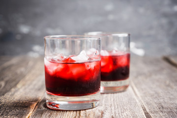 Old fashioned cherry cocktail with berries. Selective focus. Shallow depth of field. 