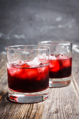 Old fashioned cherry cocktail with berries. Selective focus. Shallow depth of field. 