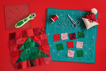 Christmas tree patchwork block, craft mat, bright square pieces of fabric, pincushion like Santa...