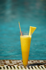 Freshly squeezed fruit pineapple orange juice  by the pool